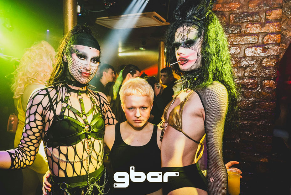 Dominate female with two drag queens, one on either side inside Gbar club Liverpool