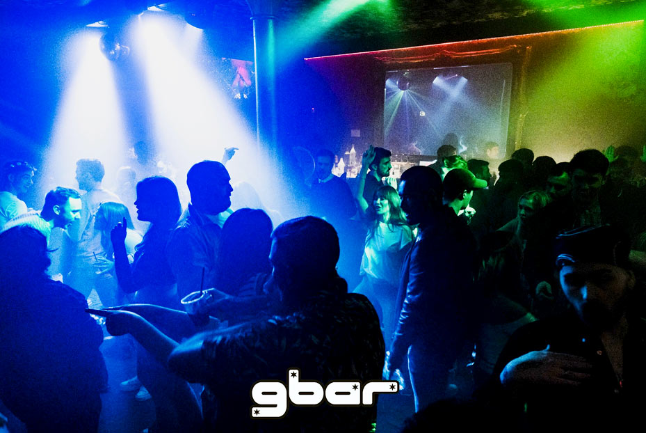 Clubbers dancing upstairs in Gbar with strobe lights