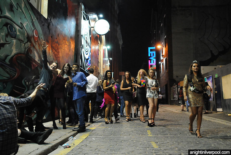 People walking past Fusion nightclub on Fleet Street in Liverpool