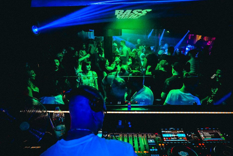 People dancing in Gbar basement showing Dj view