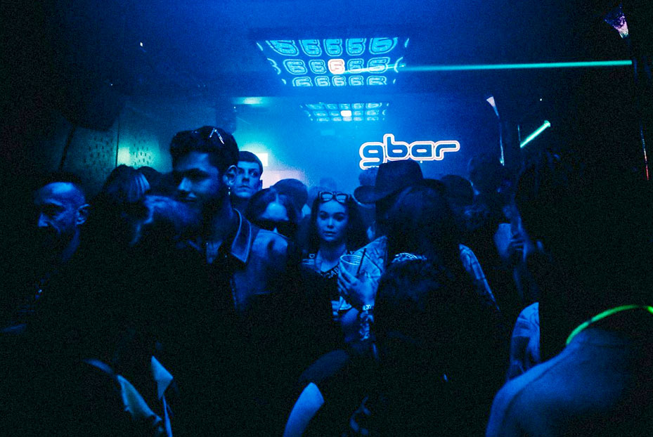 People dancing in Gbar with blue neon strobe lights